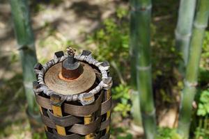 bamboo torch without fire in the garden at noon. photo