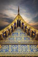 Golden roof of Thai temple with the Twilight sky. photo