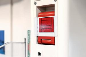 the red emergency door release switch control inside the sky train, it's set up beside the door. photo