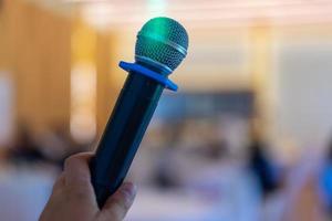 close up wireless mic in the seminar classroom with blur students behind photo