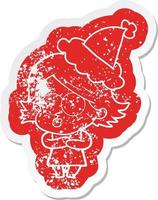 cartoon distressed sticker of a girl pouting wearing santa hat vector