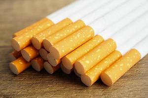 Cigarette, roll tobacco in paper with filter tube, No smoking concept. photo