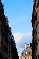 blue spring sky between houses photo