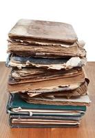 stack antique books on wooden table photo