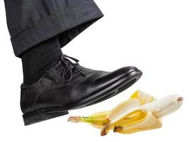 foot in the right black shoe slips on banana peel photo