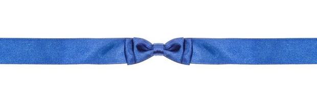 symmetric blue bow knot on narrow silk ribbon photo