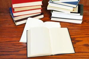 open books on wooden table photo