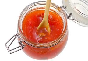 apricot jam in glass jar close up photo