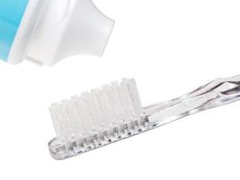 toothbrush and toothpaste from tube photo