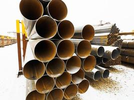 heap of steel pipes in outdoor warehouse photo