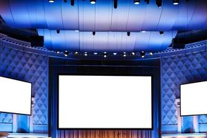 screens in blue illuminated cinema theater photo