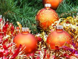orange Christmas balls, red tinsel on Xmas tree 3 photo