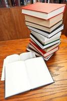 open books on wooden table photo