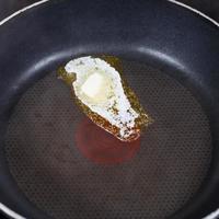 dairy butter melting on hot frying pan photo
