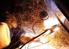 car repairs by welding in field photo