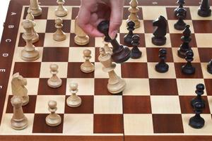 black king knocks white king in chess game photo