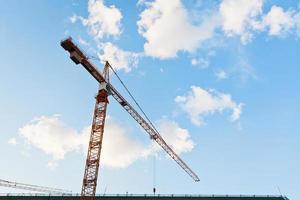 Tower crane under blue sky photo