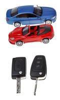 two vehicle keys and model cars photo