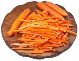 raw cleaned and strips sliced carrots on board photo