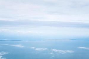horizon between blue cloudy sky and Aegean sea photo