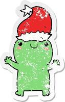 distressed sticker of a cute christmas frog vector