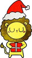 textured cartoon of a lion with christmas present wearing santa hat vector