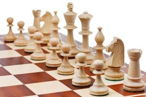 figures placed on chess board photo