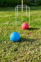 game of croquet on green lawn photo