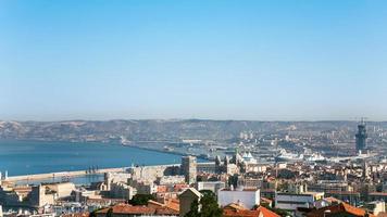 view of Marseilles city and port under blue sky photo