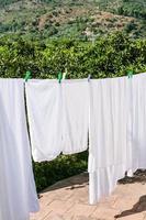 drying linen on open backyard in Sicily photo