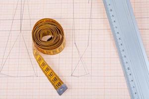 yellow measure tape and metal ruler photo