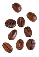 several falling roasted coffee beans photo