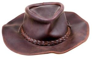 old leather brown cowboy hat isolated photo