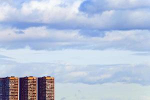 brick modern houses under blue spring sky photo