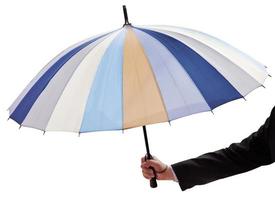 male hand with open multicolored umbrella photo