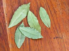 few bay leaves on table photo