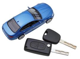 above view of two vehicle keys and model car photo