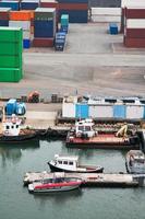boats and freight containers in cargo port photo