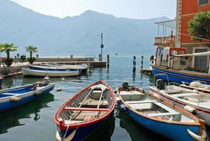 boats near pier in town limone sul garda photo