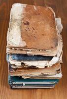 antique books on wooden shelf photo