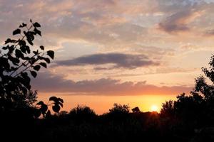 The last rays of the sun at sunset photo