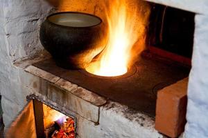 russian stove and old cast-iron pot photo