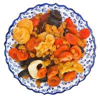 top view of dried fruits on turkish plate photo