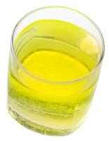 glass of yellow carbonated water with vitamin C photo