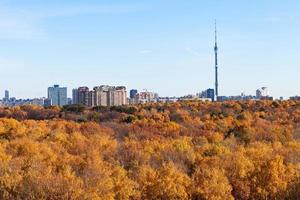 panorama with TV tower and autumn fores photo