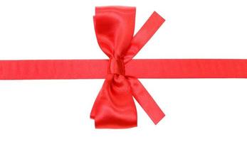 real red bow with square cut ends on silk ribbon photo