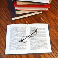 open book on wooden table photo