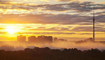 yellow sunrise in autumn city photo