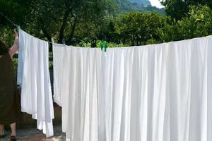 drying of white linens photo