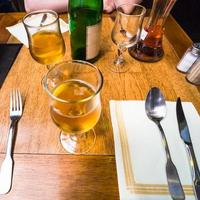 local apple cider on table in restaurant photo